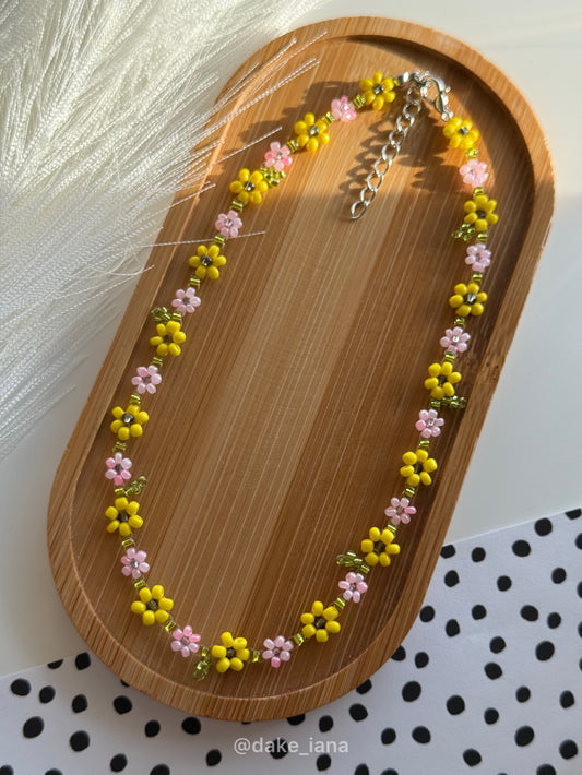 Beaded necklace with pink flowers and sunflowers