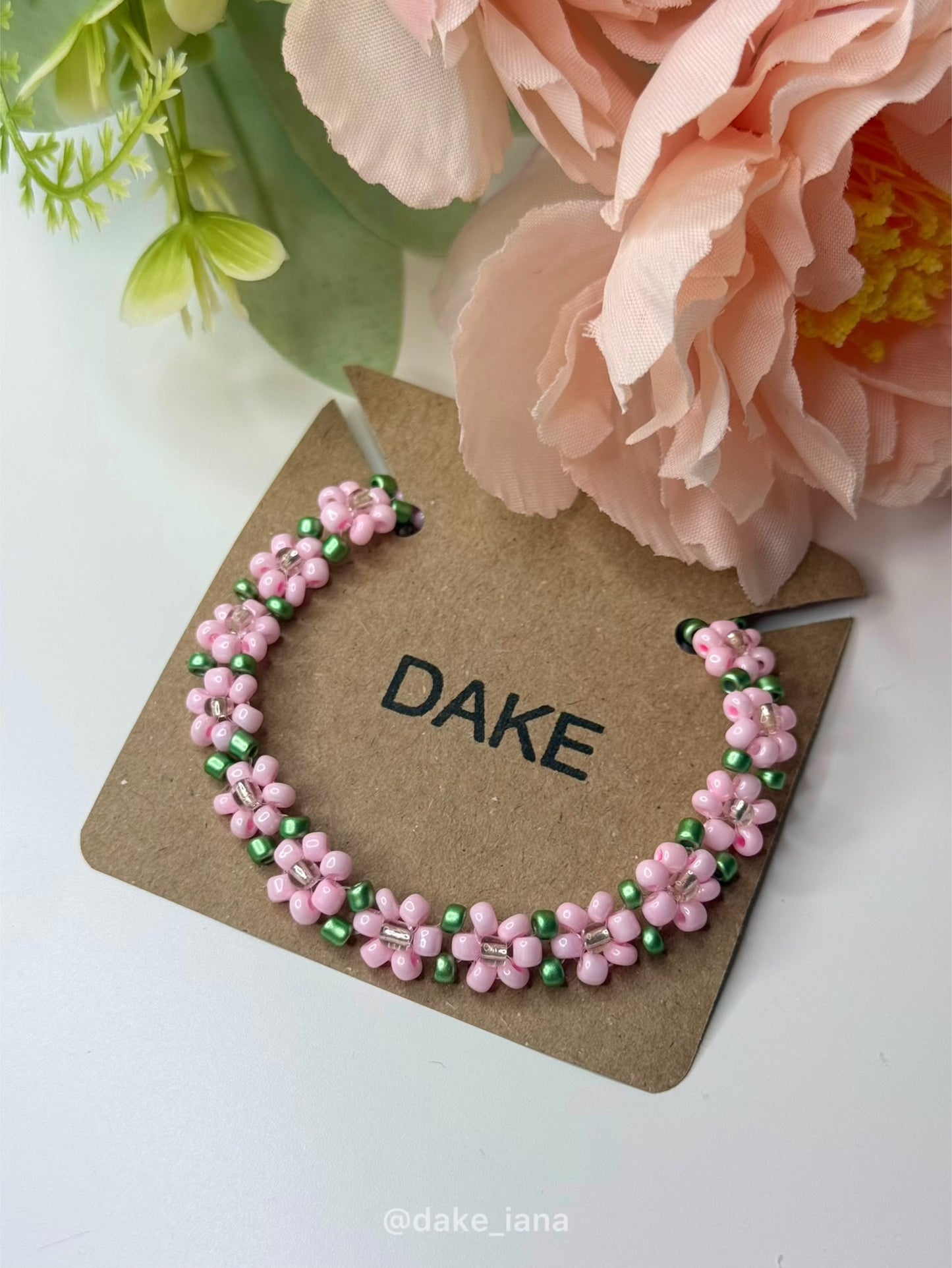 Handmade Pink Flower Beaded Bracelet with Green Accents